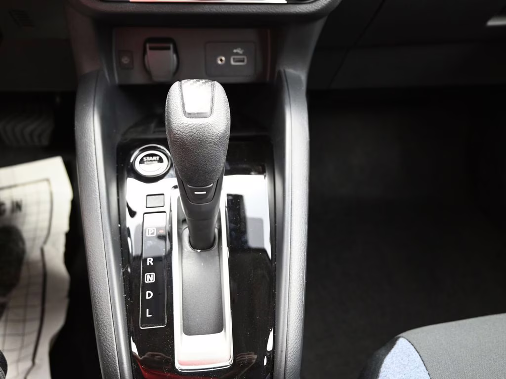 2025 Scarlet Ember Tintcoat Nissan Versa 1.6 SV FWD Sedan