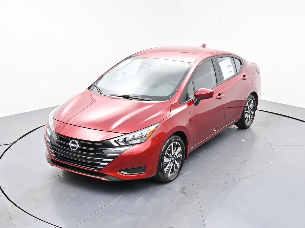 2025 Scarlet Ember Tintcoat Nissan Versa 1.6 SV FWD Sedan