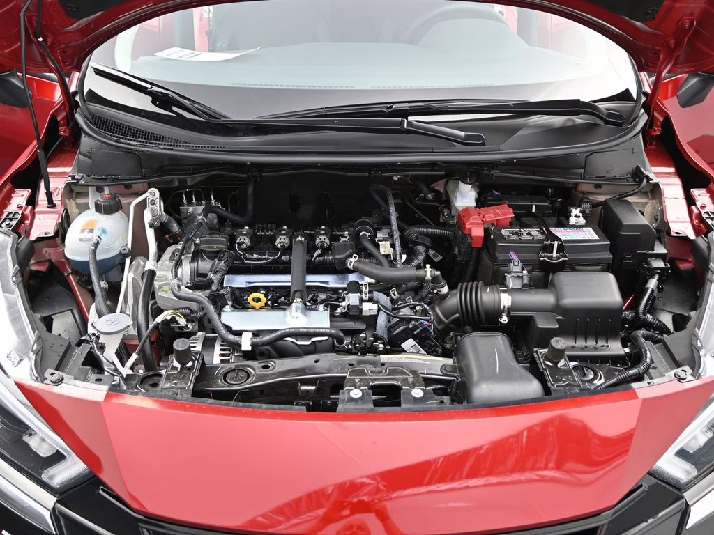 2025 Scarlet Ember Tintcoat Nissan Versa 1.6 SV FWD Sedan