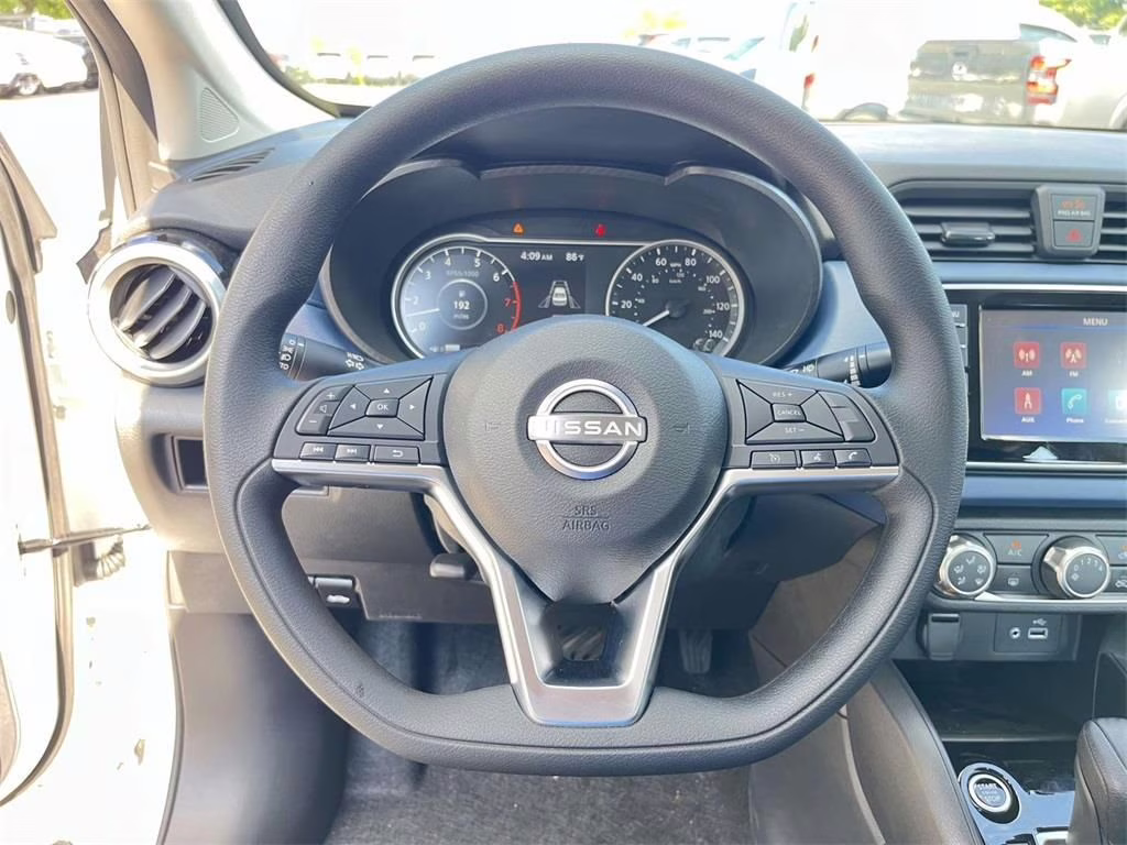 2025 Aspen White Tricoat Nissan Versa 1.6 SV FWD Sedan