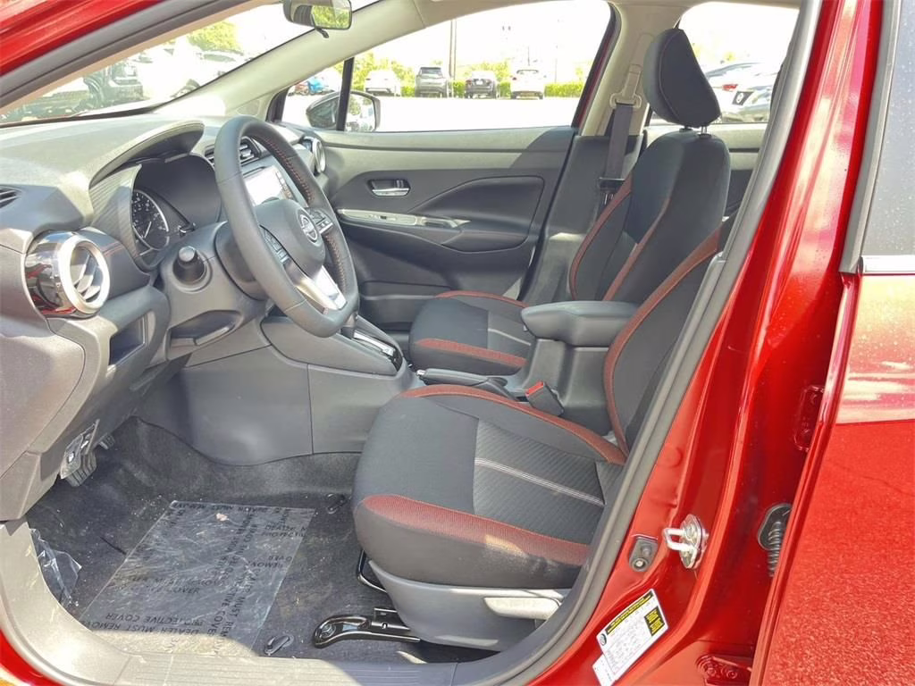 2025 Scarlet Ember Tintcoat Nissan Versa 1.6 SR FWD Sedan