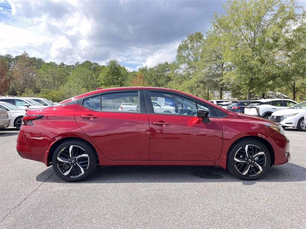 2025 Scarlet Ember Tintcoat Nissan Versa 1.6 SR FWD Sedan