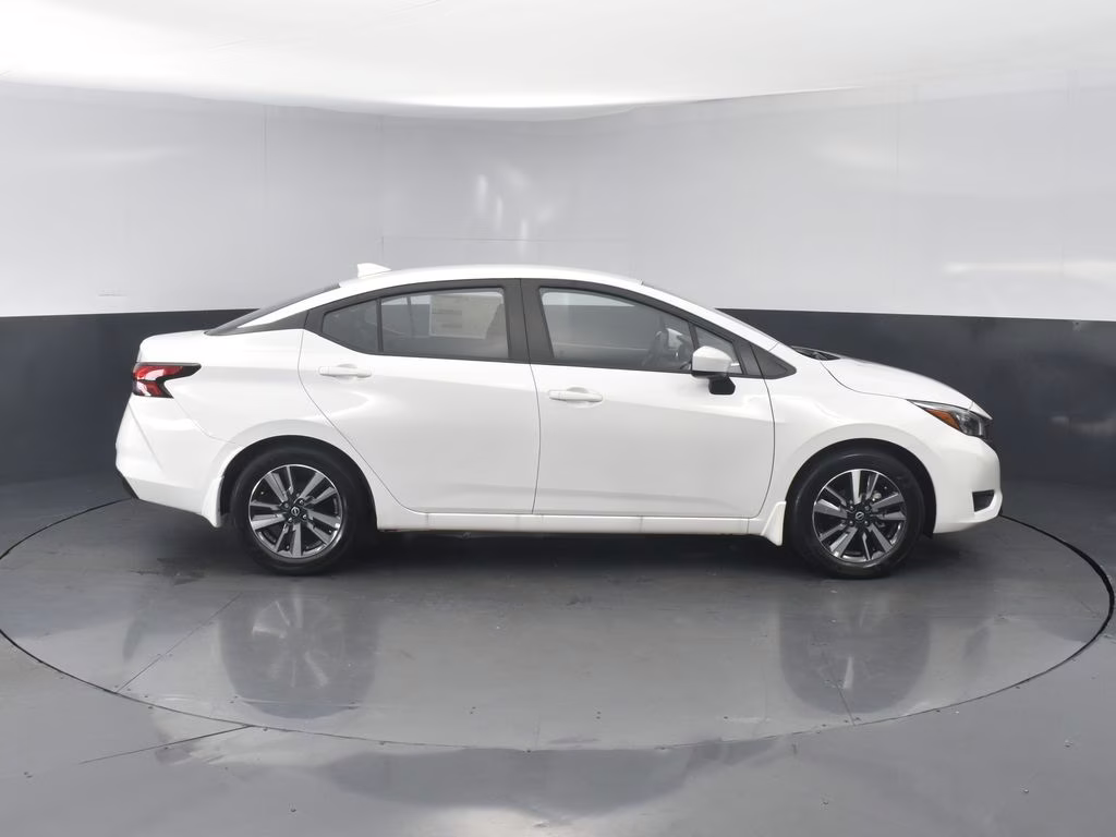 2025 Aspen White Tricoat Nissan Versa 1.6 SV FWD Sedan