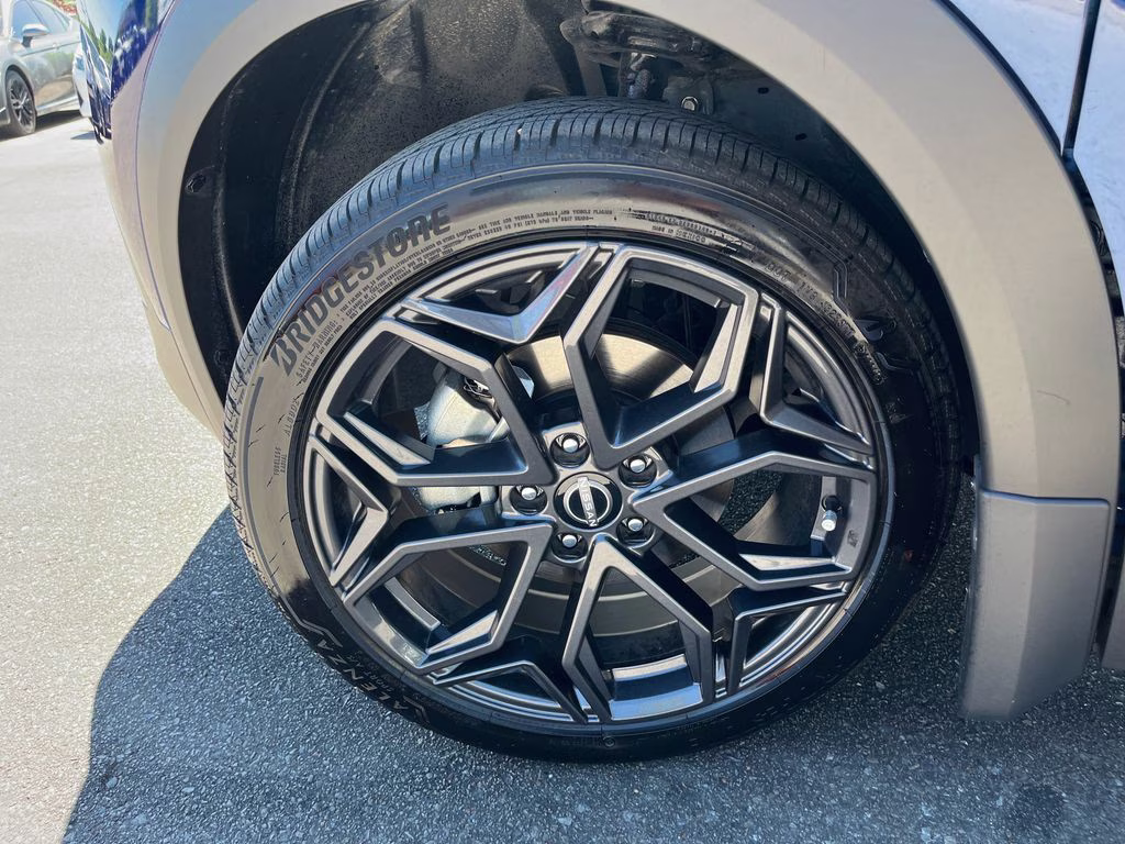 2025 Deep Blue Pearl/Gun Metallic Nissan Kicks SR FWD SUV