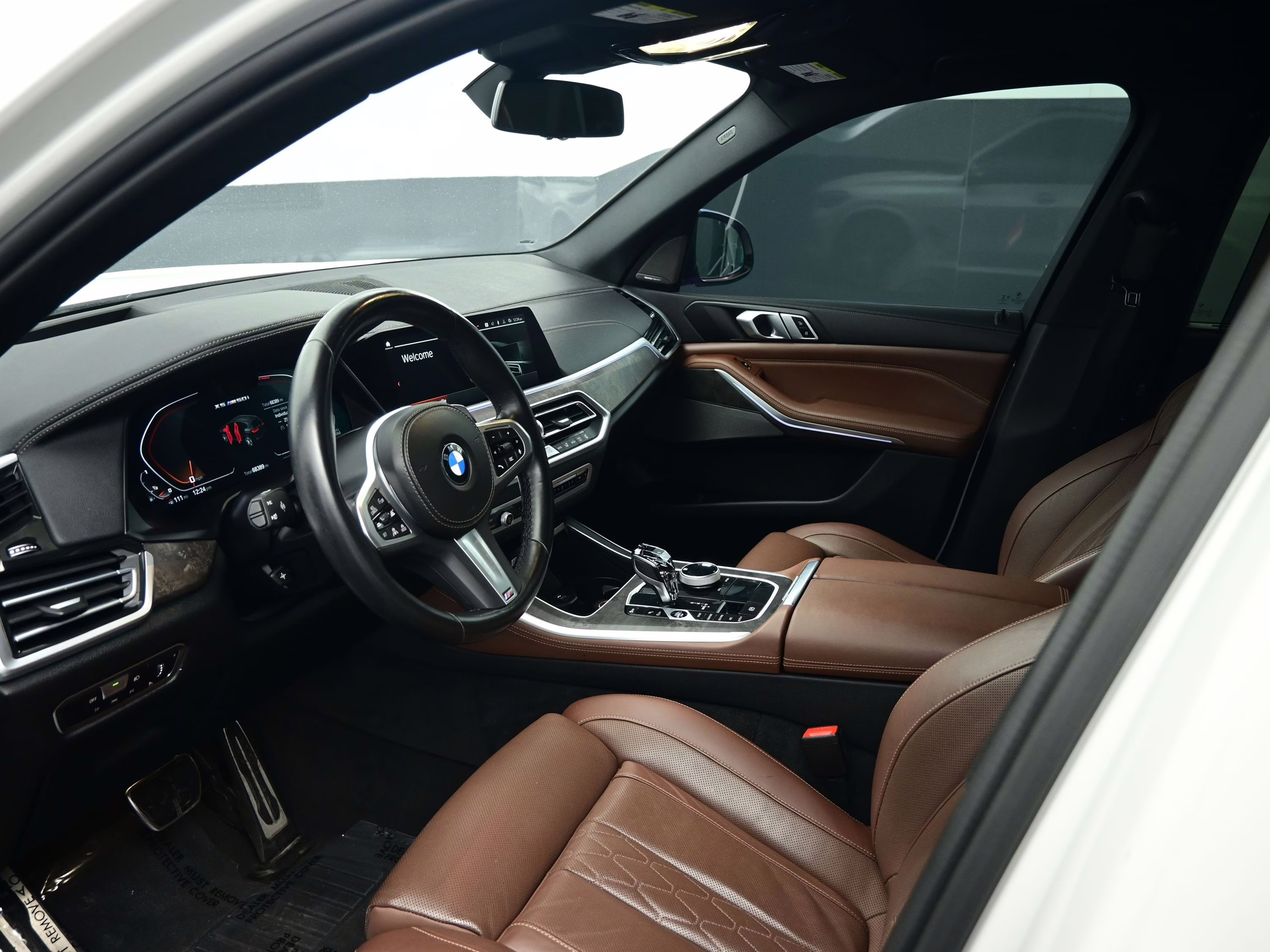 2023 Mineral White Metallic BMW X5 M50i AWD SUV