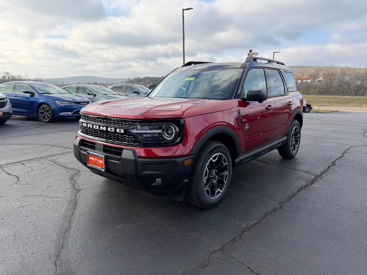 2025 Ruby Red Metallic Tinted Clearcoat Ford Bronco Sport Outer Banks 4X4 SUV
