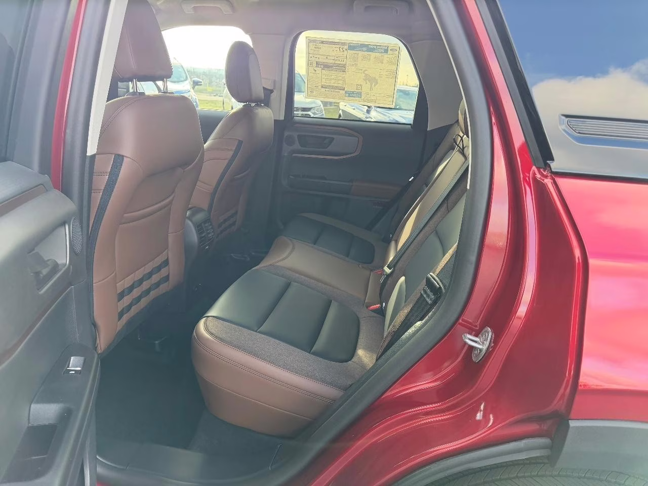 2025 Ruby Red Metallic Tinted Clearcoat Ford Bronco Sport Outer Banks 4X4 SUV