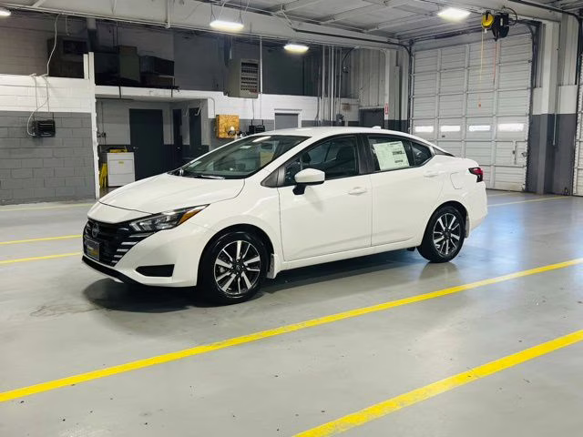 2025 Aspen White Tricoat Nissan Versa 1.6 SV FWD Sedan