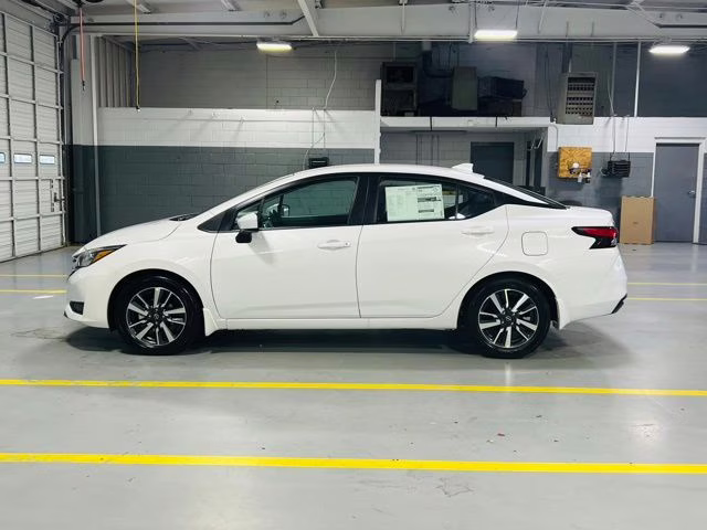 2025 Aspen White Tricoat Nissan Versa 1.6 SV FWD Sedan