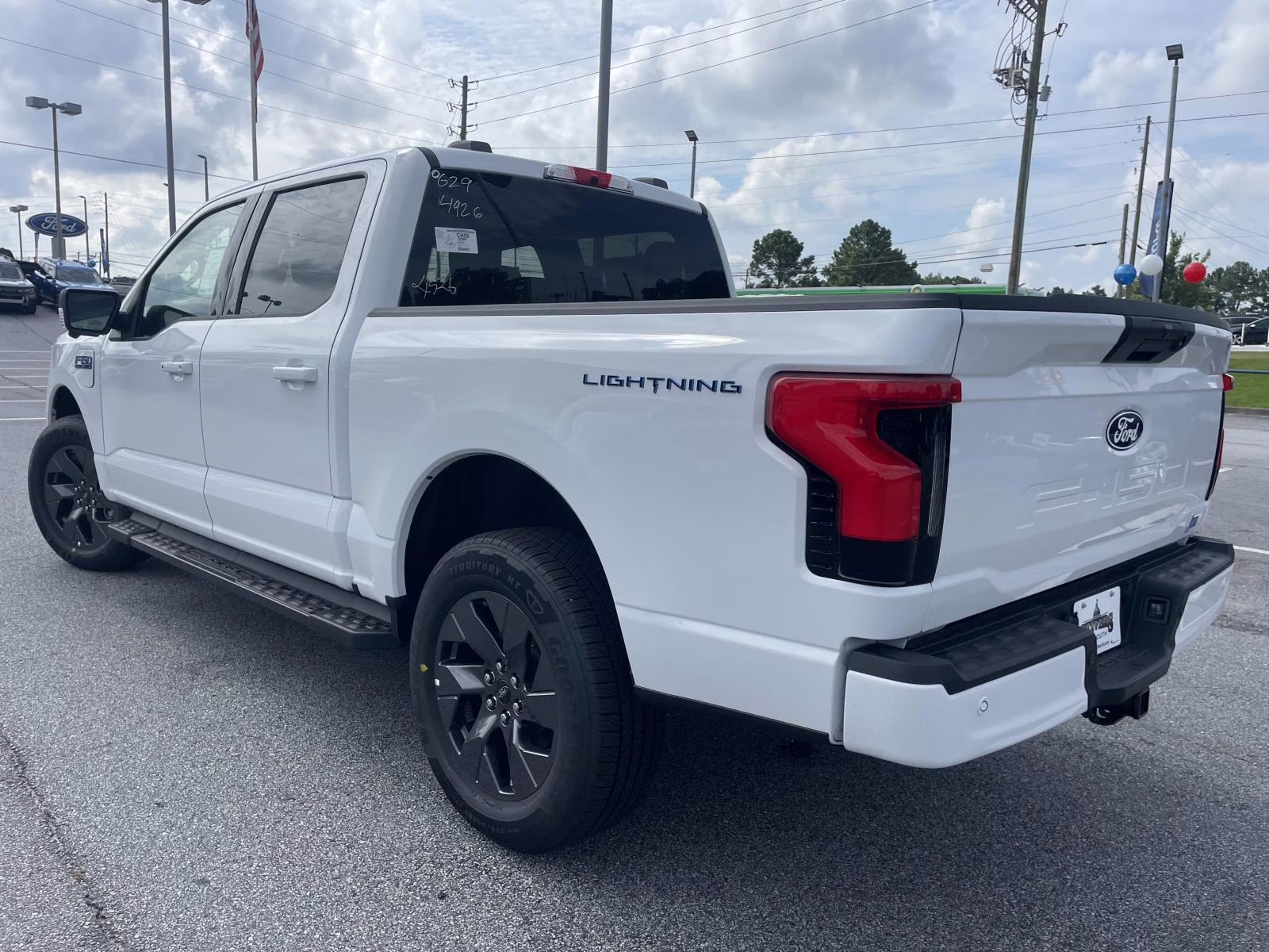 2025 Oxford White Ford F-150 Lightning Flash AWD Truck