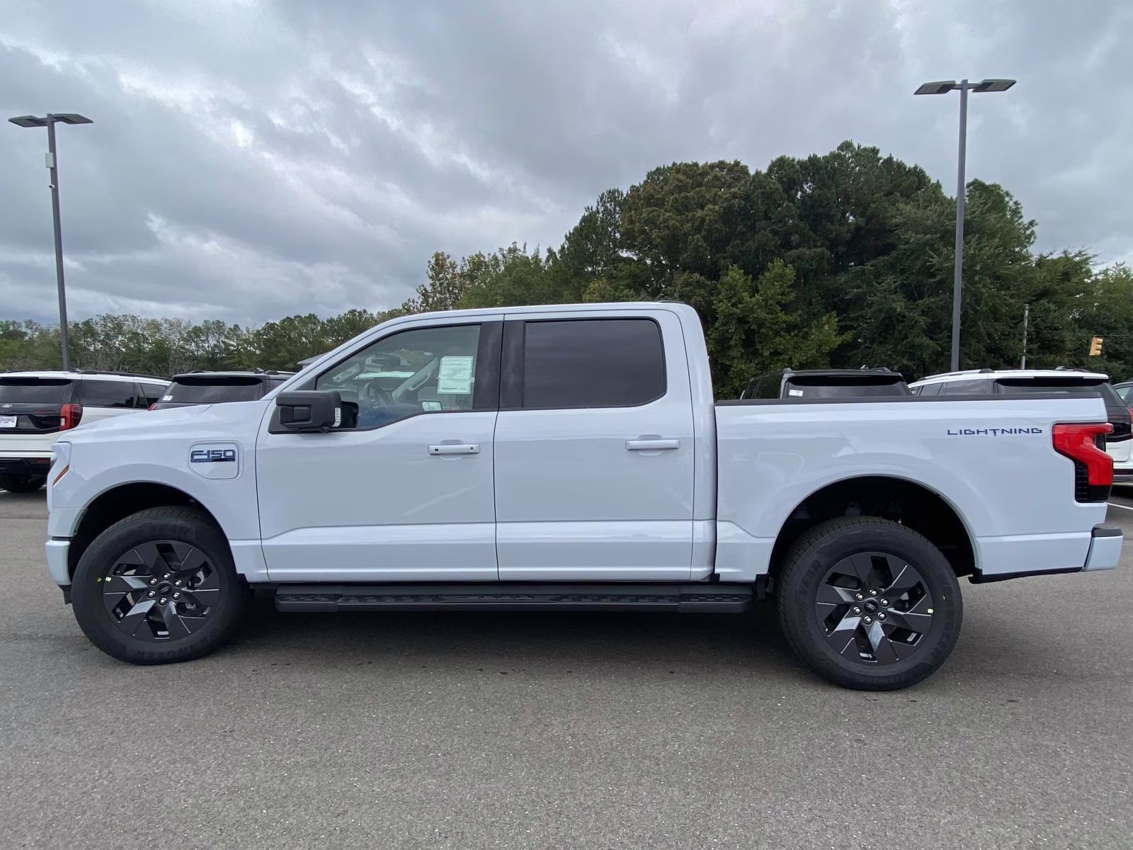 2025 Space White Metallic Ford F-150 Lightning Flash AWD Truck