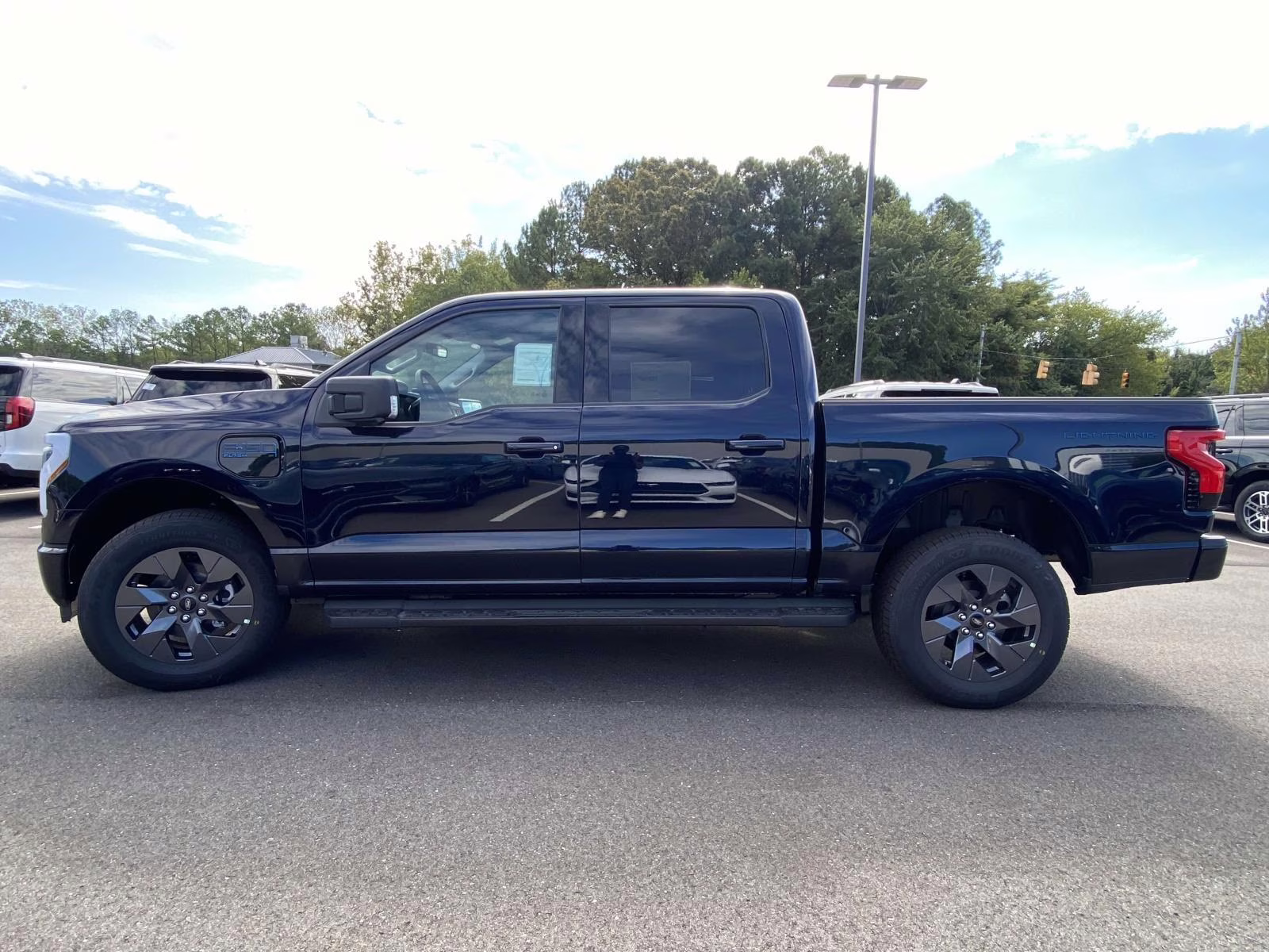 2025 Antimatter Blue Metallic Ford F-150 Lightning Flash AWD Truck