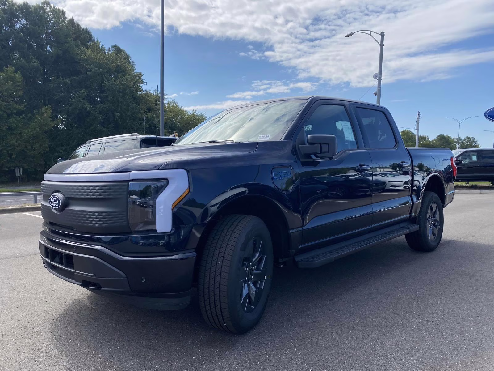 2025 Antimatter Blue Metallic Ford F-150 Lightning Flash AWD Truck