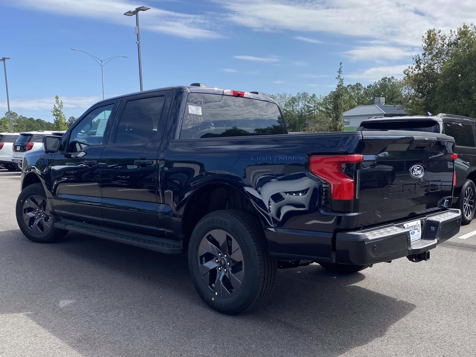 2025 Antimatter Blue Metallic Ford F-150 Lightning Flash AWD Truck