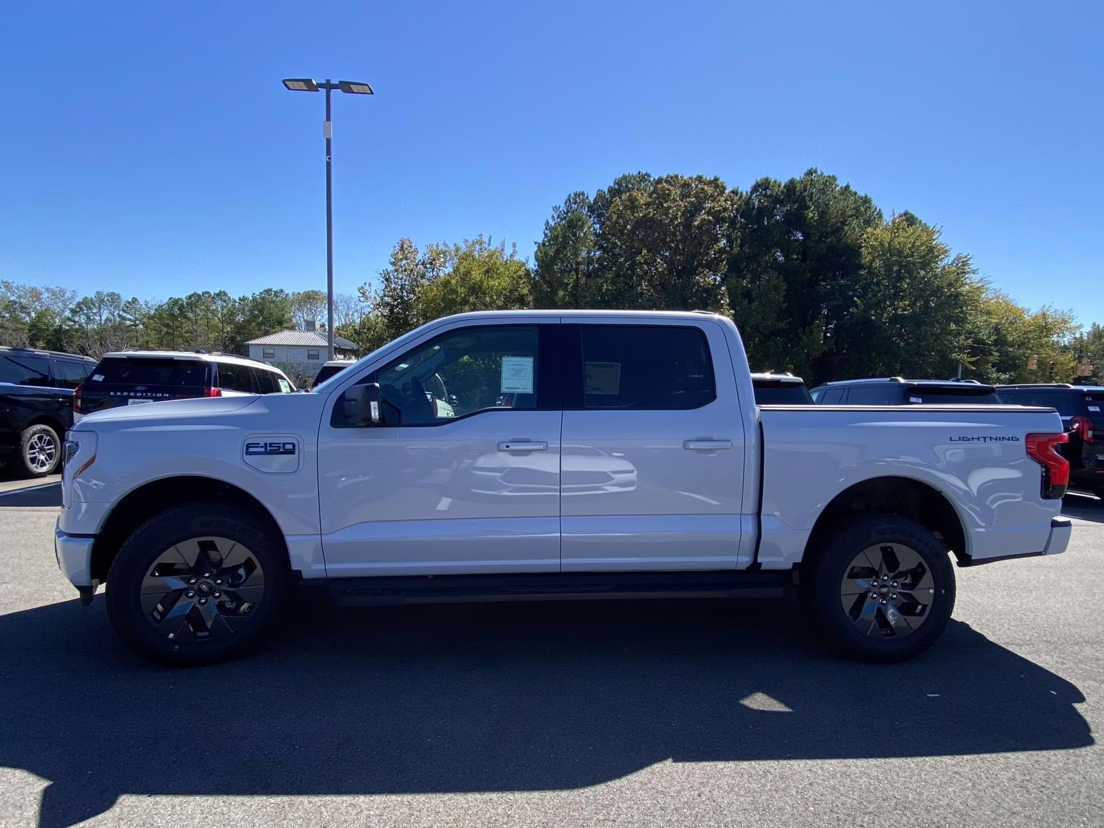 2025 Space White Metallic Ford F-150 Lightning Flash AWD Truck