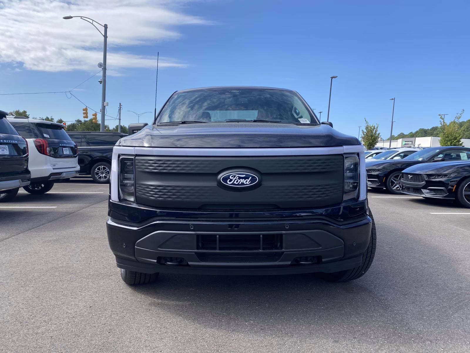 2025 Antimatter Blue Metallic Ford F-150 Lightning Flash AWD Truck