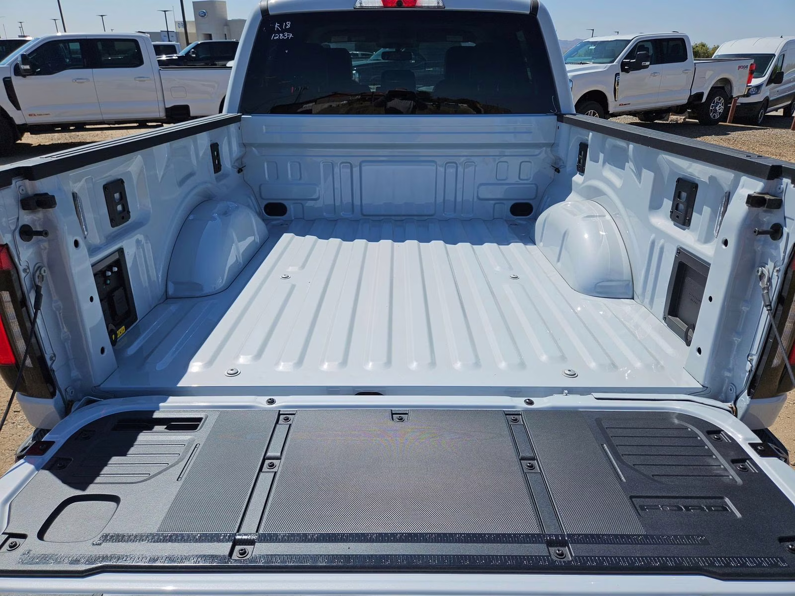 2025 White Metallic Ford F-150 Lightning Flash AWD Truck