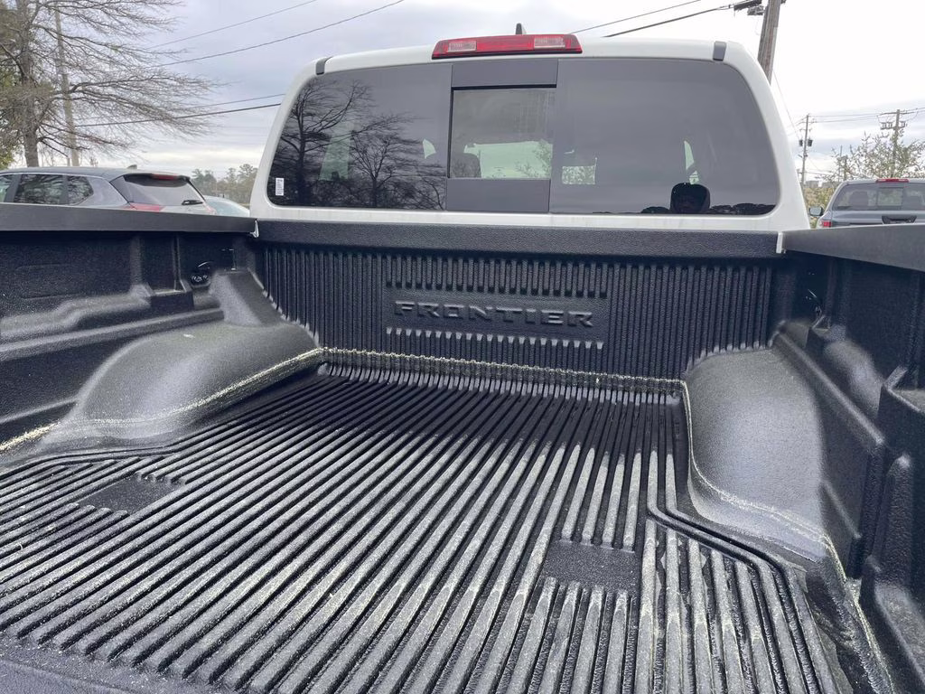 2026 Glacier White Nissan Frontier SV 4X4 Truck