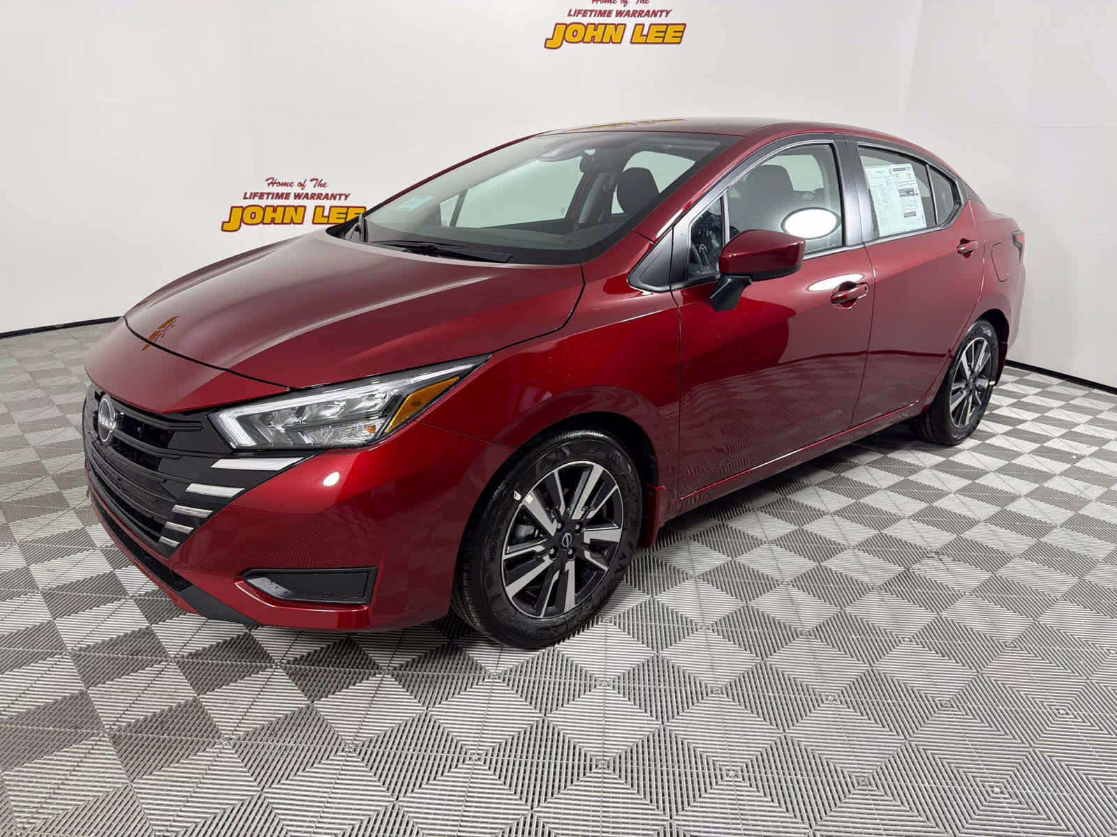 2025 Scarlet Ember Tintcoat Nissan Versa SV FWD Sedan