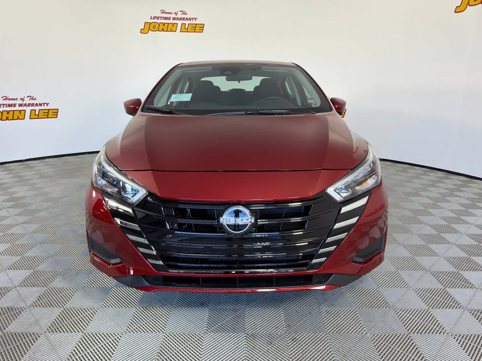 2025 Scarlet Ember Tintcoat Nissan Versa SV FWD Sedan