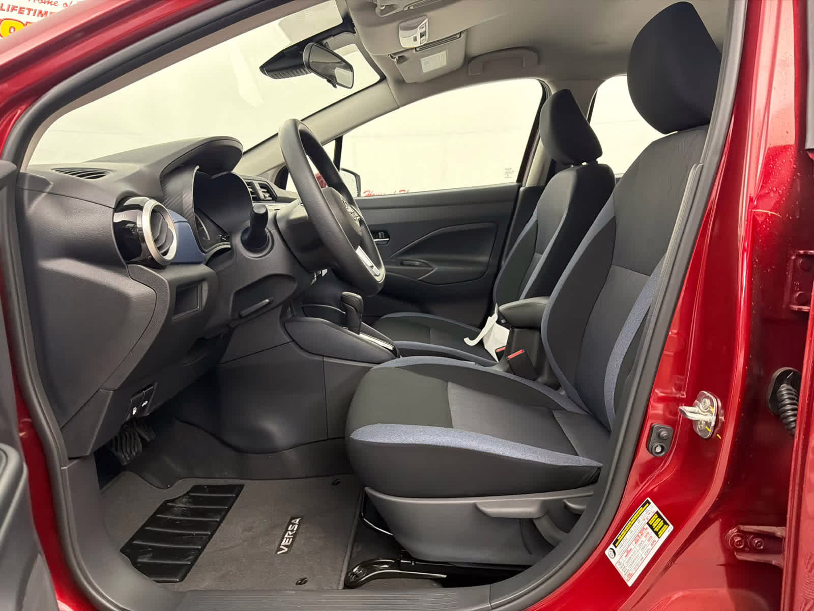 2025 Scarlet Ember Tintcoat Nissan Versa SV FWD Sedan