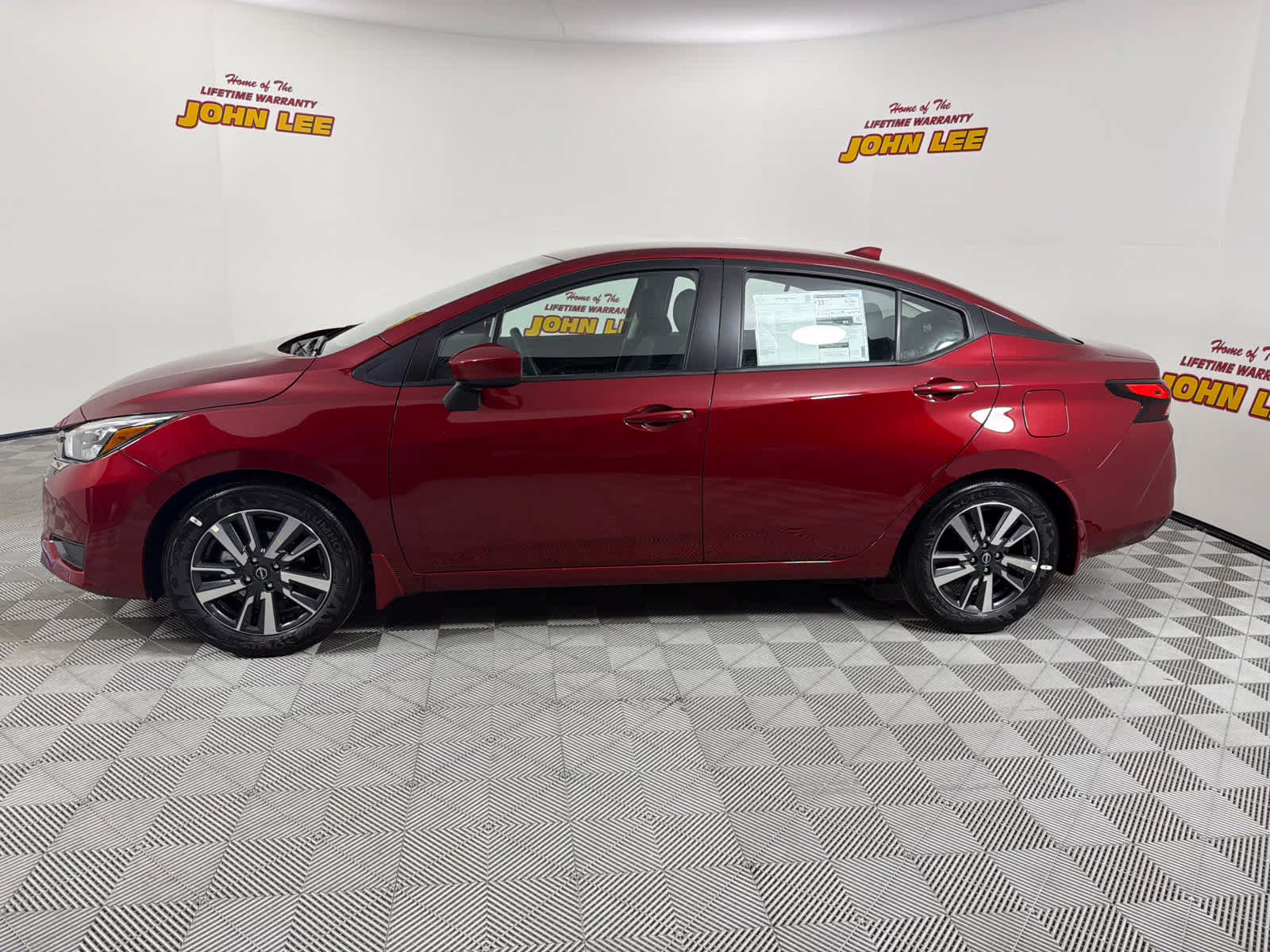 2025 Scarlet Ember Tintcoat Nissan Versa SV FWD Sedan