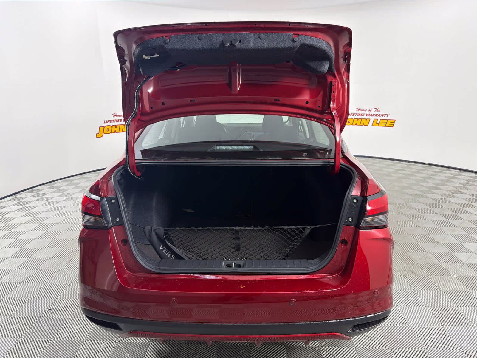 2025 Scarlet Ember Tintcoat Nissan Versa SV FWD Sedan