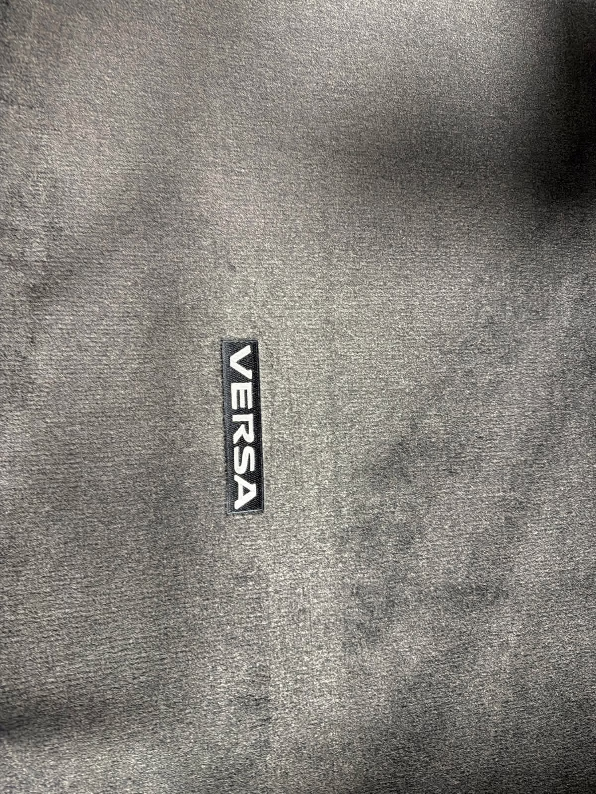 2025 Scarlet Ember Tintcoat Nissan Versa SV FWD Sedan