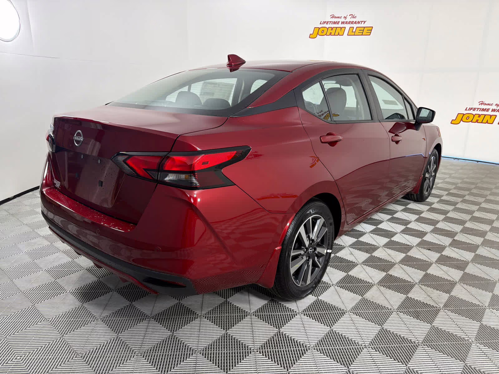 2025 Scarlet Ember Tintcoat Nissan Versa SV FWD Sedan