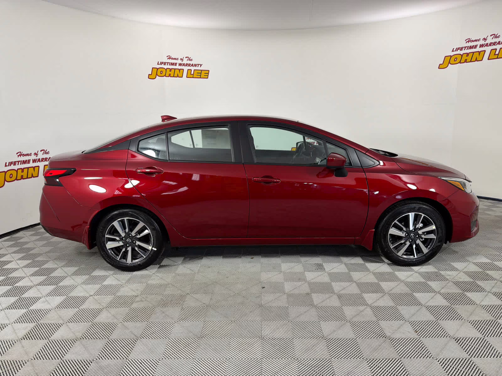 2025 Scarlet Ember Tintcoat Nissan Versa SV FWD Sedan