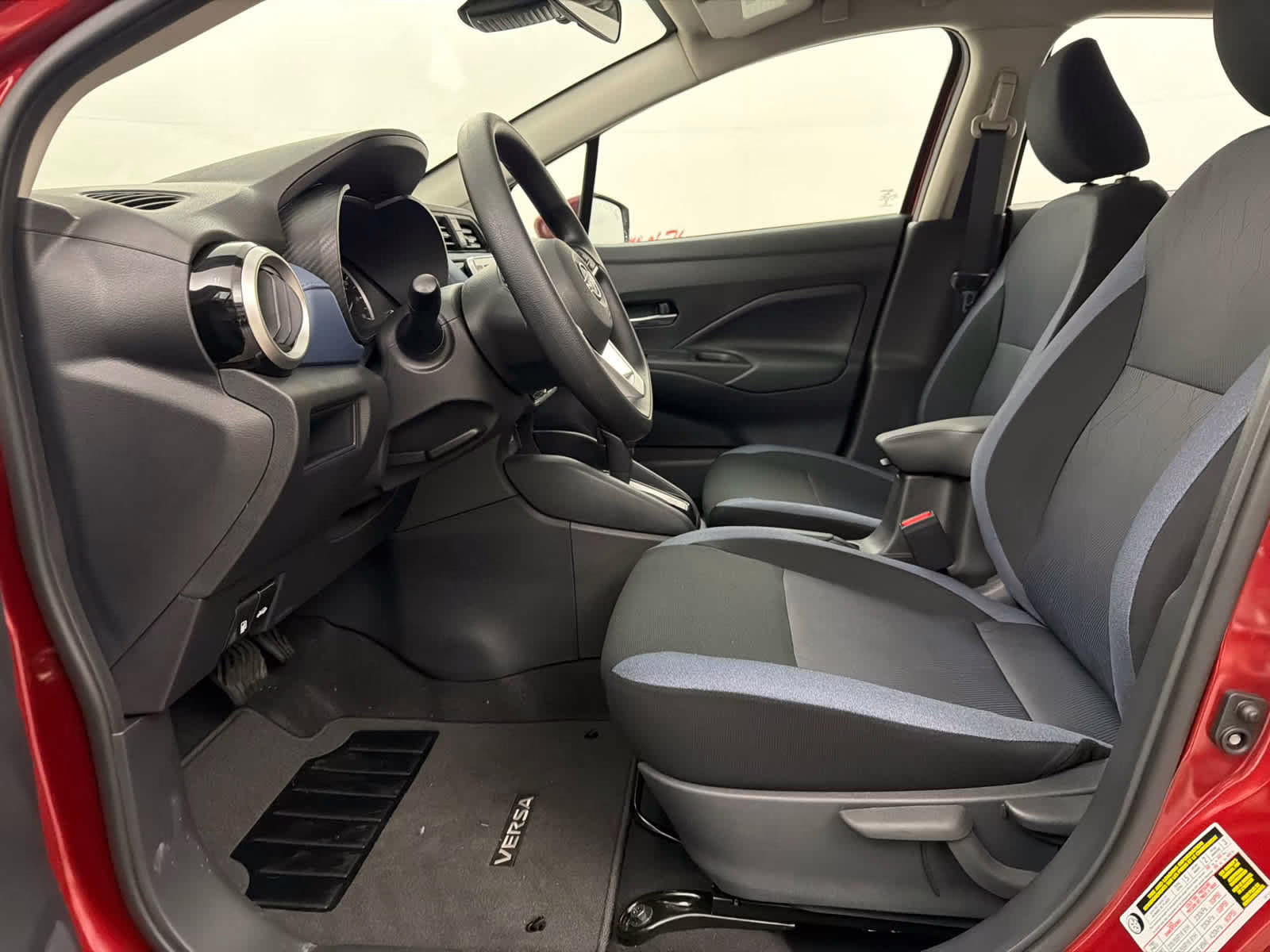 2025 Scarlet Ember Tintcoat Nissan Versa SV FWD Sedan