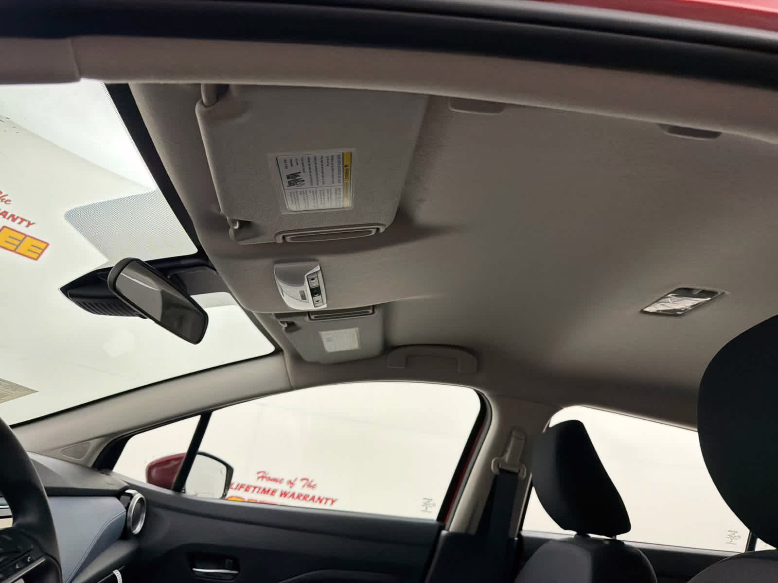 2025 Scarlet Ember Tintcoat Nissan Versa SV FWD Sedan