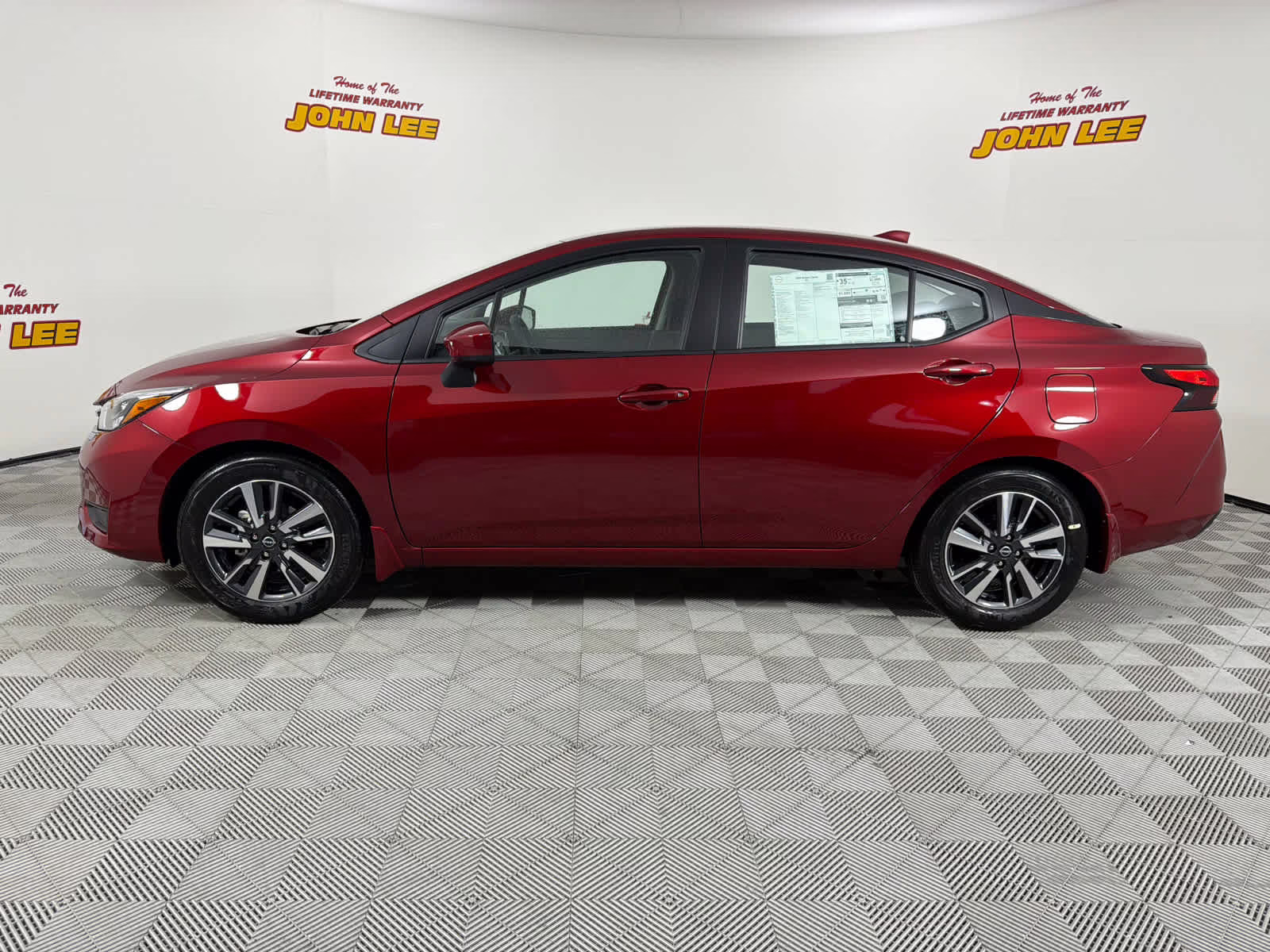 2025 Scarlet Ember Tintcoat Nissan Versa SV FWD Sedan