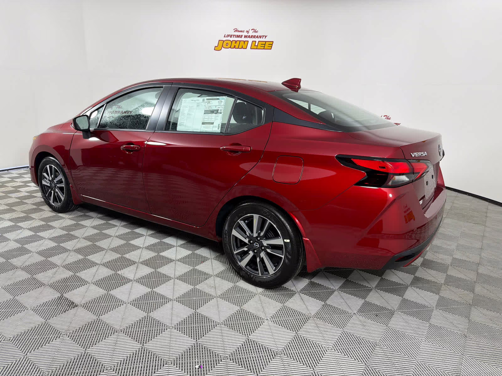 2025 Scarlet Ember Tintcoat Nissan Versa SV FWD Sedan