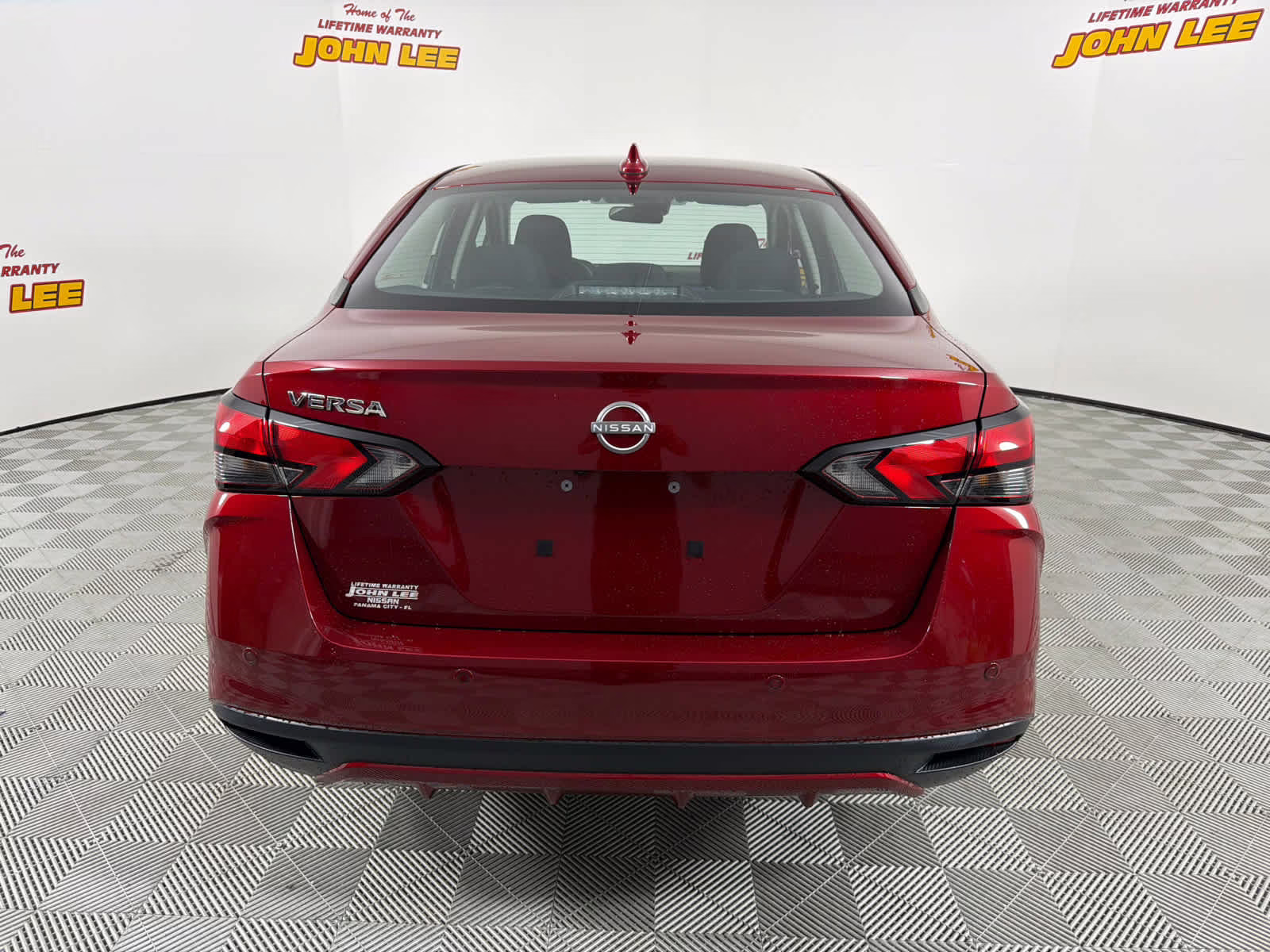 2025 Scarlet Ember Tintcoat Nissan Versa SV FWD Sedan
