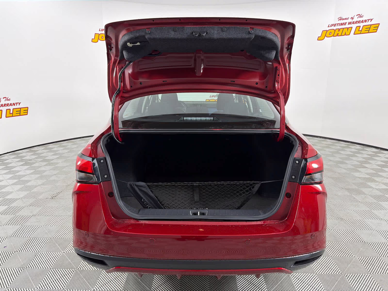 2025 Scarlet Ember Tintcoat Nissan Versa SV FWD Sedan