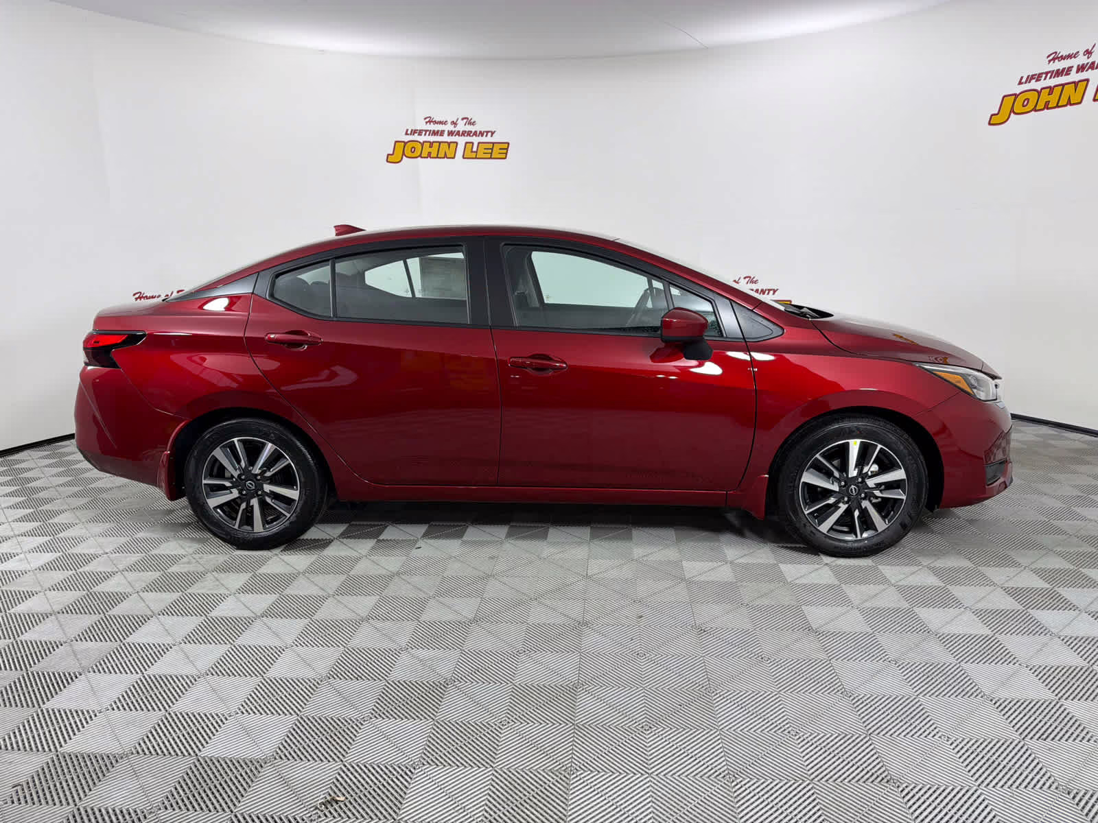 2025 Scarlet Ember Tintcoat Nissan Versa SV FWD Sedan