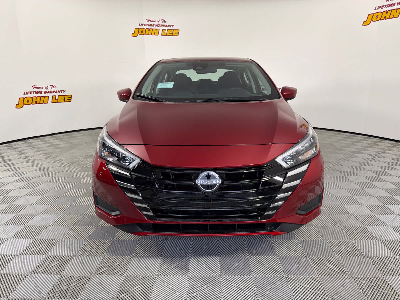 2025 Scarlet Ember Tintcoat Nissan Versa SV FWD Sedan