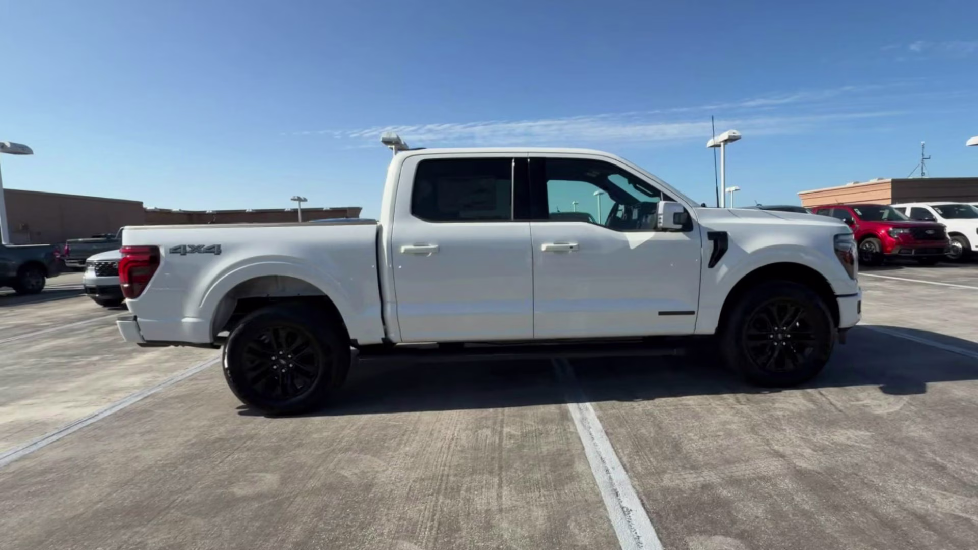 2026 Star White Metallic Tri-Coat Ford F-150 LARIAT Crew Cab Pickup 4X4 Truck