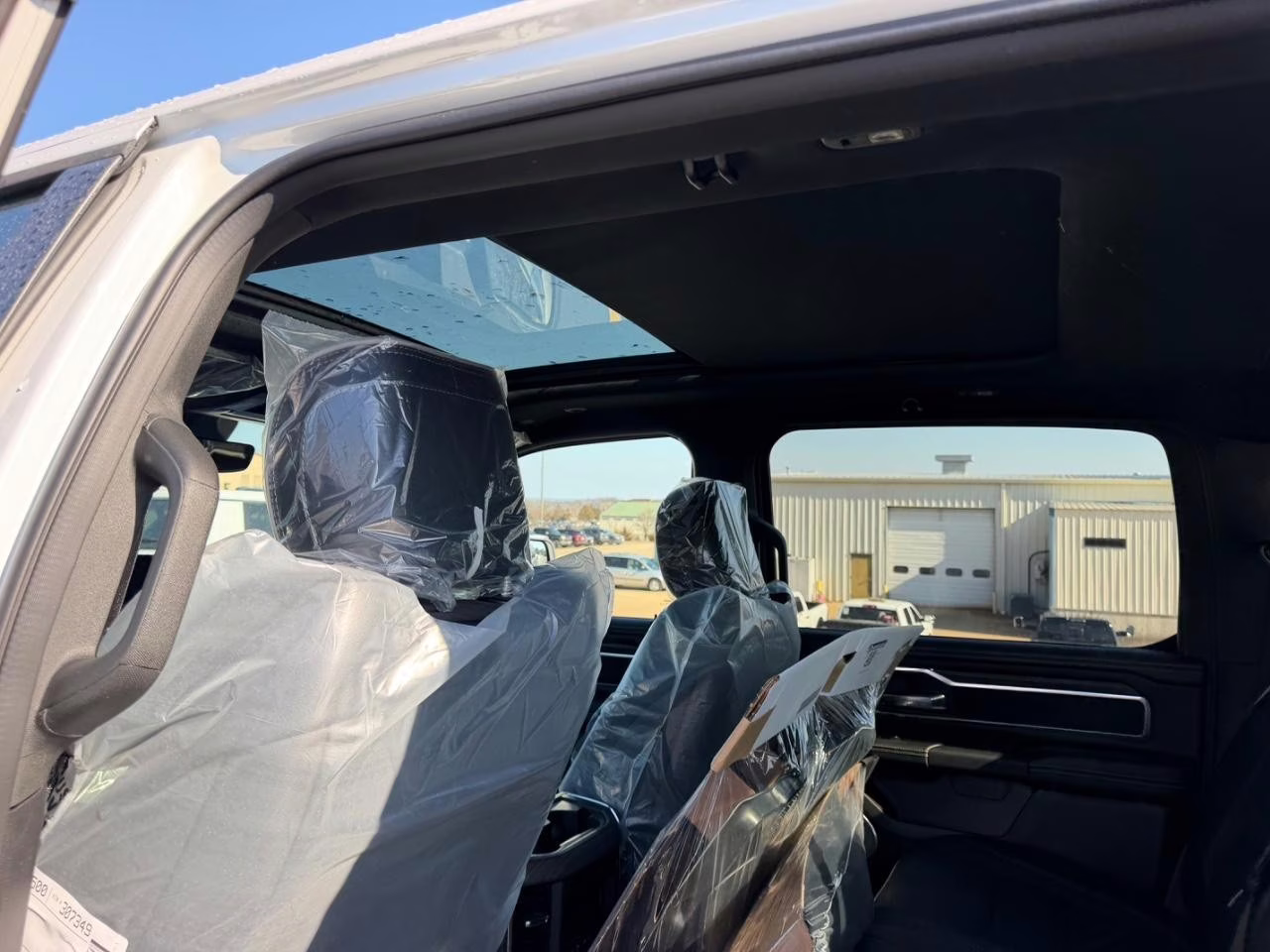 2026 Ivory White Tri-Coat Pearlcoat Ram 1500 Laramie 4X4 Truck