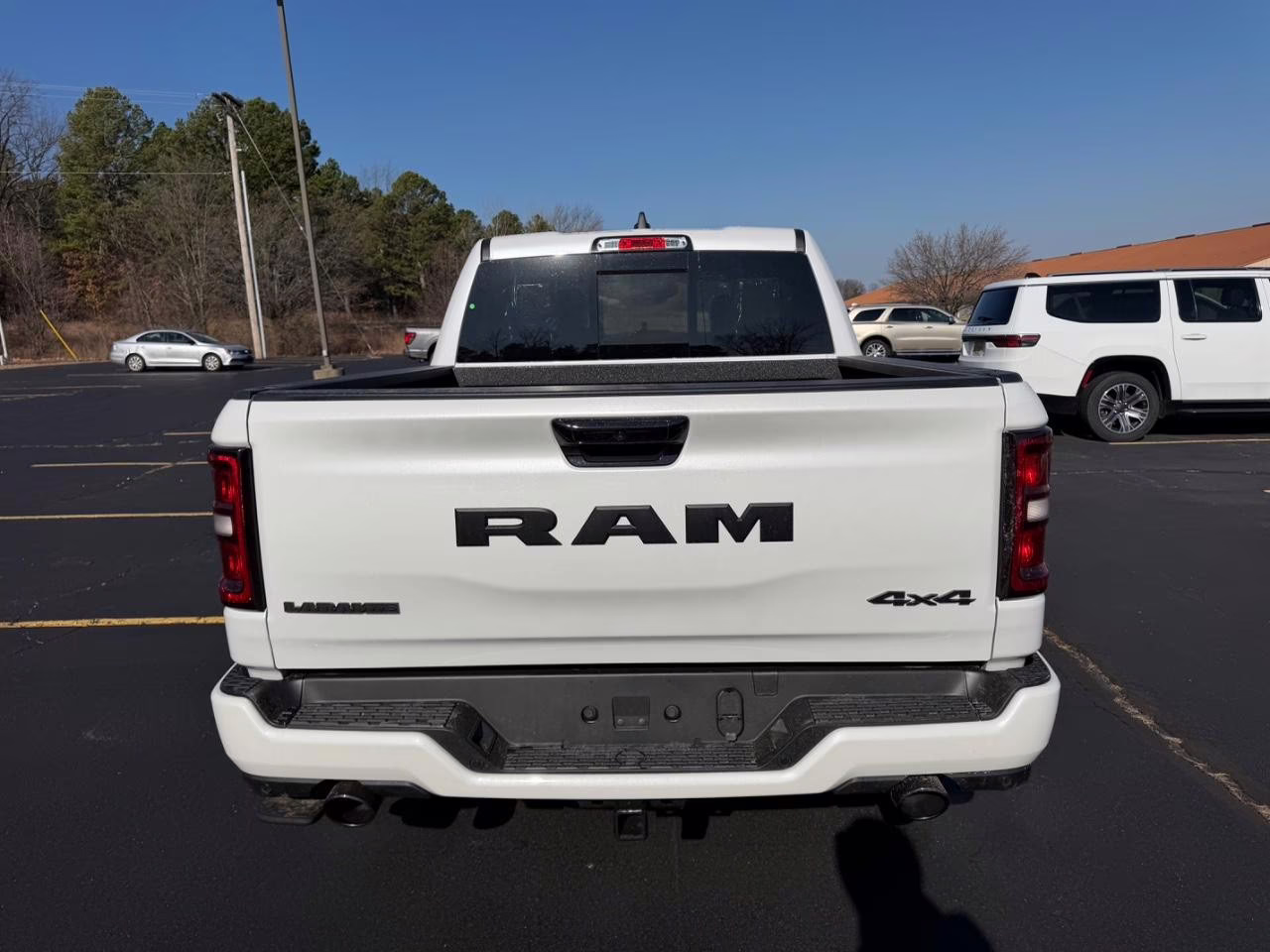 2026 Ivory White Tri-Coat Pearlcoat Ram 1500 Laramie 4X4 Truck