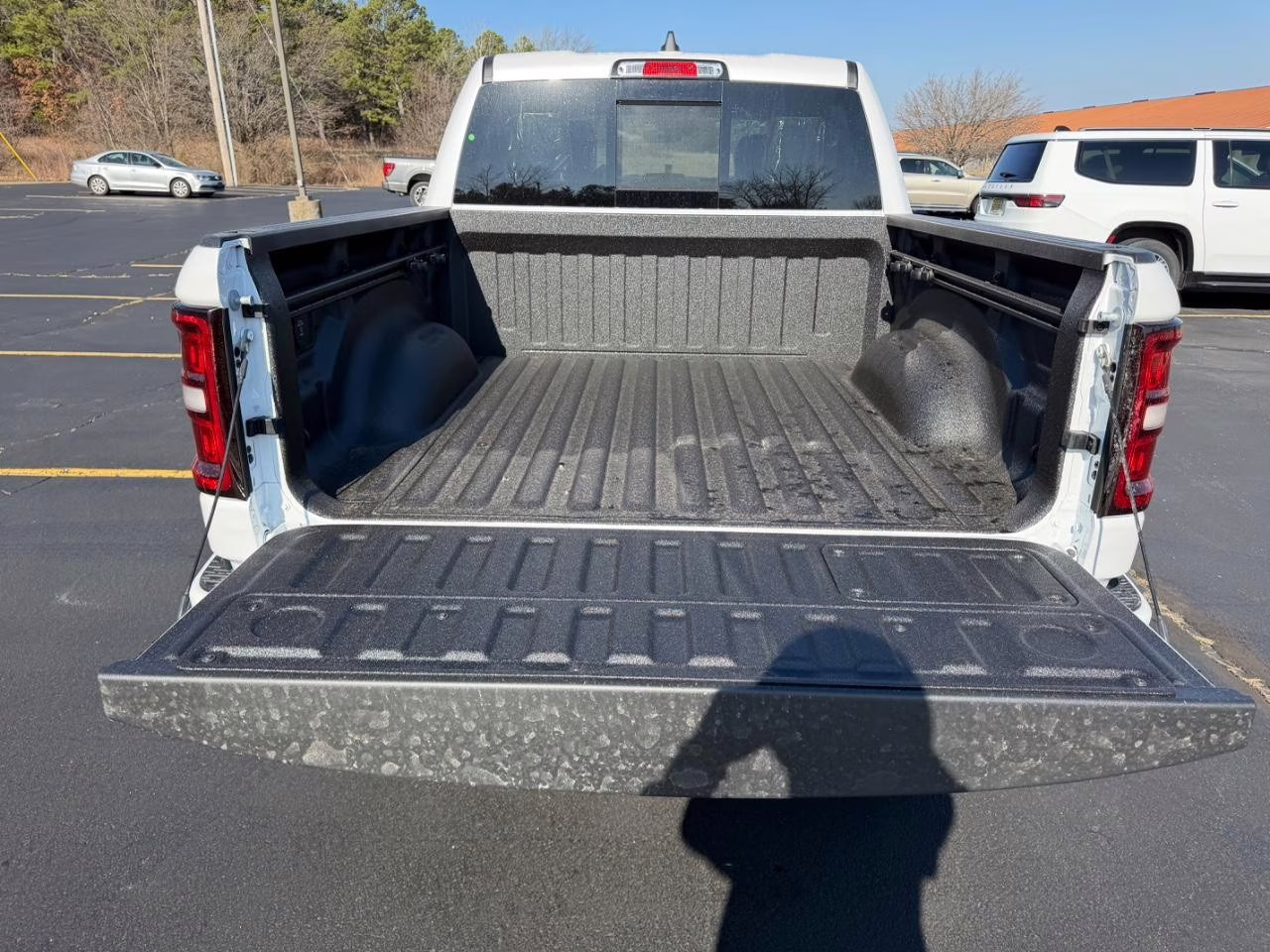 2026 Ivory White Tri-Coat Pearlcoat Ram 1500 Laramie 4X4 Truck