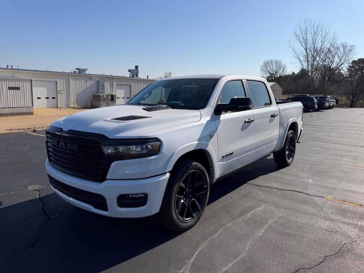 2026 Ivory White Tri-Coat Pearlcoat Ram 1500 Laramie 4X4 Truck