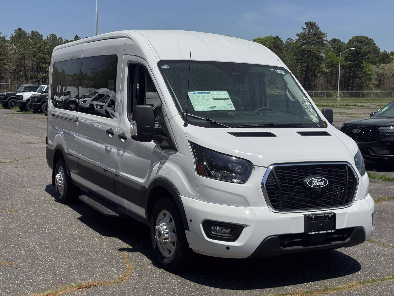 2026 Oxford White Ford Transit Passenger Wagon T-350 148 Med Roof XLT AWD AWD Van