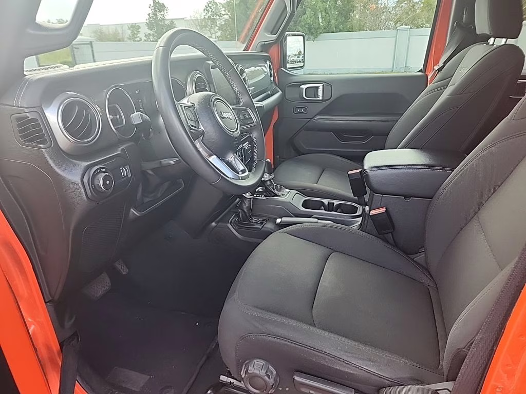 2023 orange Jeep Wrangler Sahara 4X4 SUV