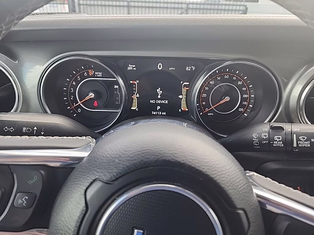 2023 orange Jeep Wrangler Sahara 4X4 SUV