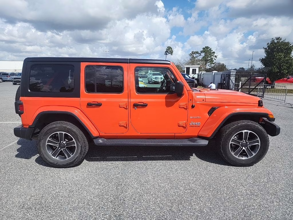 2023 orange Jeep Wrangler Sahara 4X4 SUV