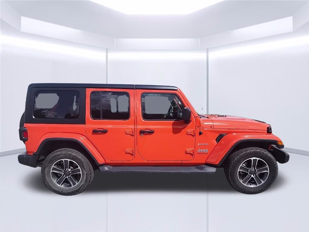 2023 orange Jeep Wrangler Sahara 4X4 SUV