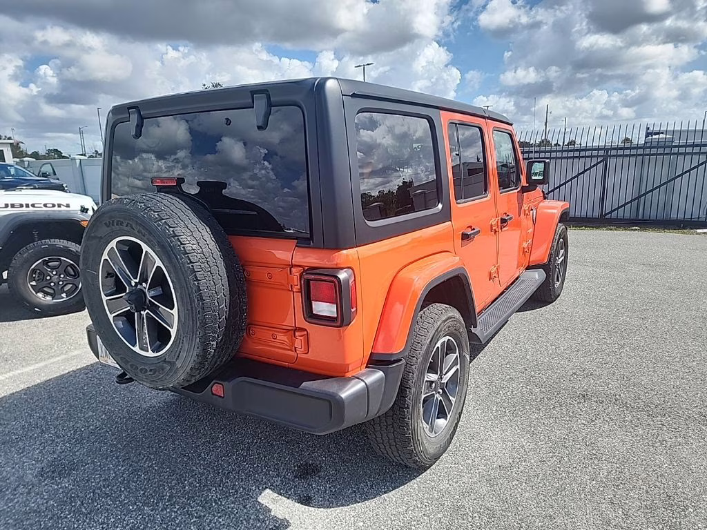 2023 orange Jeep Wrangler Sahara 4X4 SUV