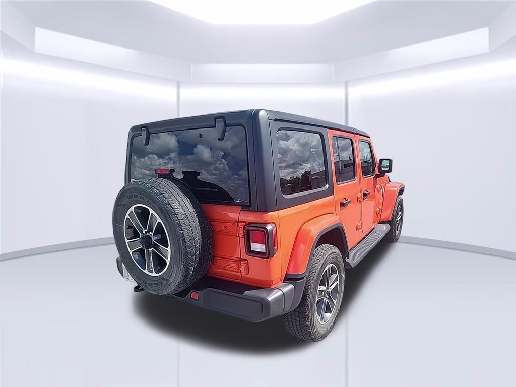 2023 orange Jeep Wrangler Sahara 4X4 SUV